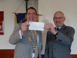 Immediate Past President Tony Neeson, the happy winner of the big prize in June 2013 being presented with his cheque.